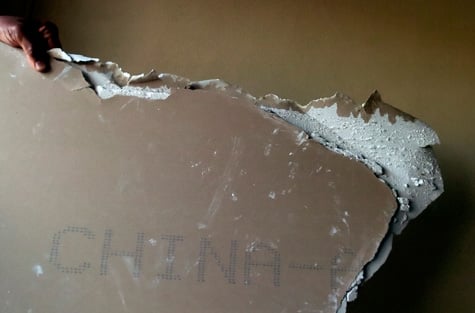 Remnants of Chinese drywall sit in an infested home in the Venetian
Golf and River Club in North Venice, Fla., on Friday, May 20, 2010.
(Chip Litherland / Sarasota Herald Tribune)
