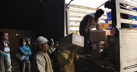 Afghan employees from the Independent Election Commission load election materials into a truck to be sent to provinces on Oct. 22, 2009. Afghanistan's presidential rivals are reigniting their campaigns for a second vote, but two previously unreleased audits produced by U.N. investigators raise questions about the integrity of the elections commission. (Shah Marai/AFP/Getty Images)