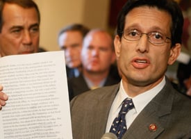 Rep. Eric Cantor (R-Va.) holds up House Speaker Nancy Pelosi's statement while speaking to the media after the vote failed on the bailout on Capitol Hill on Sept. 29, 2008. (Mark Wilson/Getty Images)