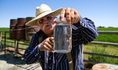 Louis Meeks’ well water contains methane gas, hydrocarbons, lead and copper, according to the EPA’s test results. When he drilled a new water well, it also showed contaminants. The drilling company Encana is supplying Meeks with drinking water. (Abrahm Lustgarten / ProPublica)
