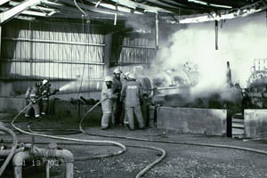 Firefighters extinguish the blaze after an explosion ripped through an injection well site in Rosharon, Texas, on Jan. 13, 2003, killing three workers. (Photo courtesy of the Chemical Safety Board)