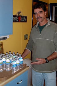 Big Flats, N.Y, resident Joseph Todd turned to bottled water after his well water suddenly turned murky and smelly, shortly after gas drilling began. (Peter Mantius/<a  data-cke-saved-href='http://dcbureau.org/index.php' href='http://dcbureau.org/index.php' _cke_saved_href='http://dcbureau.org/index.php'>DCBureau.org</a>)