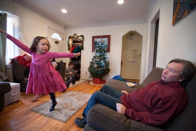Willie Rembis watches his daughter Cinderella, 4, dance in the living room of their rental home in Warren, Mich. (Jeffrey Sauger for ProPublica)