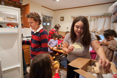 Claire and Willie Rembis and their nine children live in close quarters in their rented home in Warren, Mich. (Jeffrey Sauger for ProPublica)