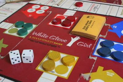 White Glove Girl, a Manpower game made in 1966. The object of the game is to be the first to earn money to afford four goals: children's college education, a vacation, home remodeling and a new wardrobe. (Krista Kjellman Schmidt /ProPublica)