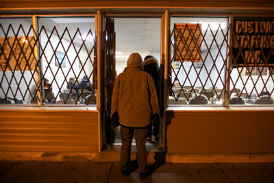 Temp workers line up at Custom Staffing near Chicago in the early morning hours of Jan. 18, 2013. (Sally Ryan for ProPublica)