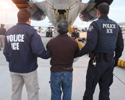 Pedro Pimentel Rios is transferred to a plane bound for Guatemala by U.S. Immigration and Customs Enforcement officials at Phoenix Mesa Gateway airport in Arizona on July 12, 2011. (U.S. Immigration and Customs Enforcement)
