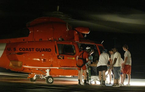 Staff members prepare the last patient to be evacuated from Memorial Medical Center in New Orleans on Sept. 1, 2005. (Brad Loper/Dallas Morning News/Corbis)