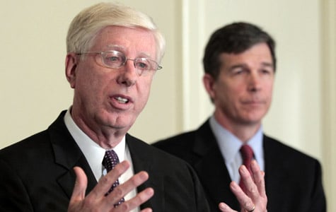 Iowa Attorney General Tom Miller, left, speaks as North Carolina Attorney General Roy Cooper, right, listens at a news conference at the National Association of Attorneys General spring meeting on March 7, 2011, in Washington. The attorneys general, along with several federal agencies, sent the largest mortgage servicers a proposal last week related to the servicers' foreclosure abuses last week. (Luis M. Alvarez/AP Photo)