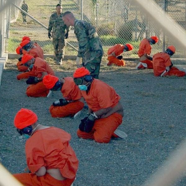Detainees at Camp X-Ray in Naval Base Guantanamo Bay. Credit: Dept. of Defense