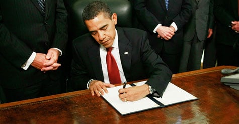 U.S. President Barack Obama signs an executive order to close down the detention center at Guantanamo Bay Cuba at the White House on January 22, 2009 in Washington, DC.  (Photo by Mark Wilson/Getty Images)