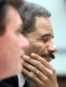 Former Deputy Attorney General Eric Holder testifies at a Congressional hearing about Marc Rich's pardon. (2001 Reuters file photo)