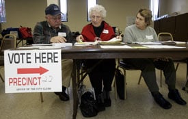 Poll workers wait for voters during the 2008 Michigan primary election in Warren, Mich. (Reuters/Rebecca Cook)