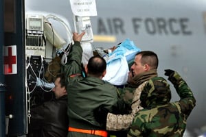 ABC News reporter Bob Woodruff is carried on a stretcher from a
bus to a  medical evacuation plane at Ramstein airbase, southern
Germany, on Jan. 31, 2006. (Michael Probst/AP Photo)