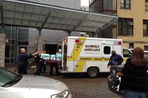 EMS units take patients as Coney Island Hospital evacuates on Oct 30. (Sheri Fink)