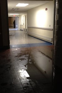 A flooded hallway at Coney Island Hospital on Oct. 30. Evacuations continued into the night on Oct. 31, according to a health official. (Sheri Fink)