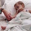 Oct. 16, 2006: Natalie Fullerton, 14 months old, survives a double-lung transplant. Her father will later use an AM2PAT syringe to clear an implanted tube near her heart.