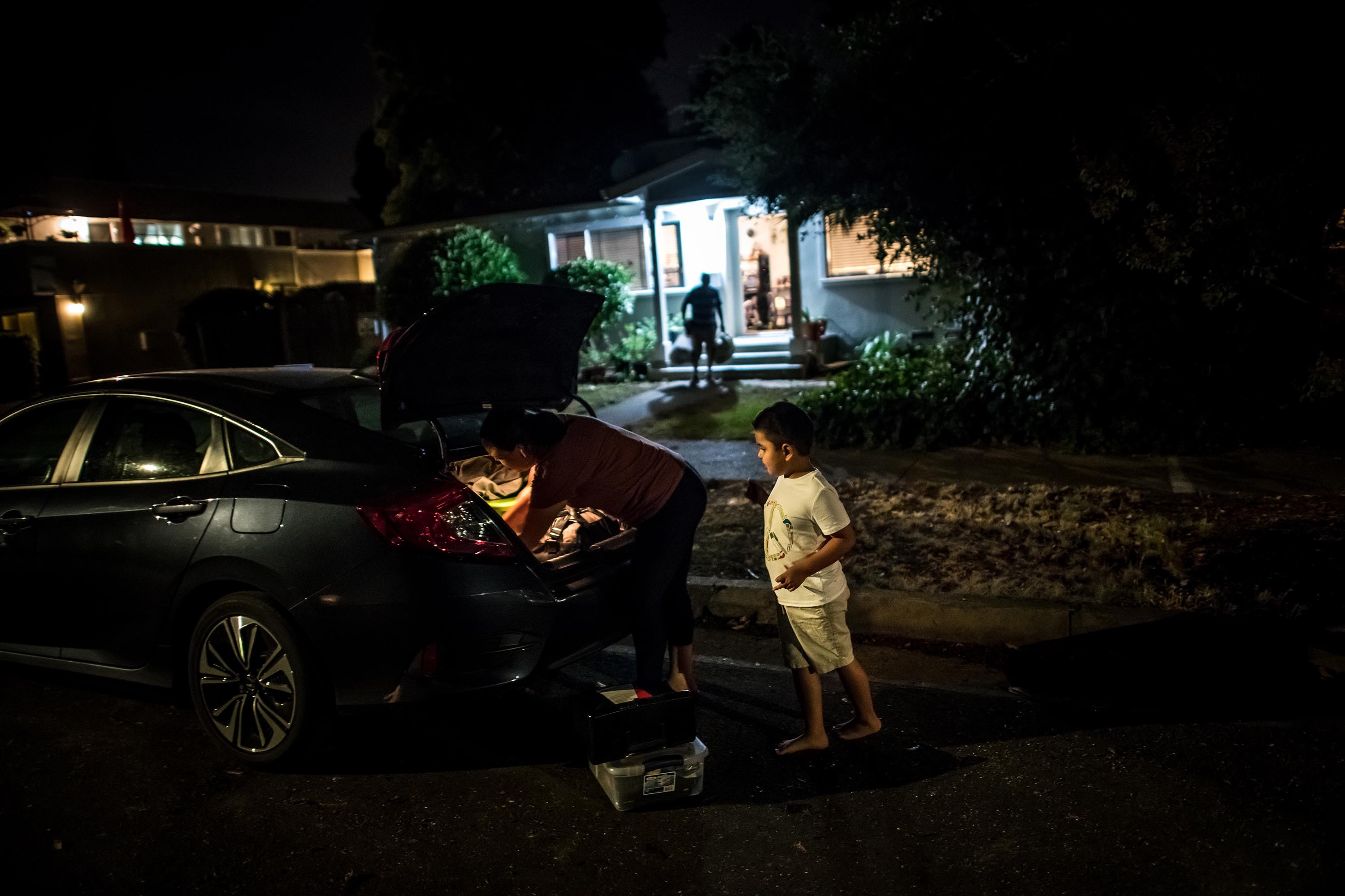 Erika González and her son, Kevin, evacuating their home in Sonoma County, California, as the LNU Lightning Complex Fire approached in August.