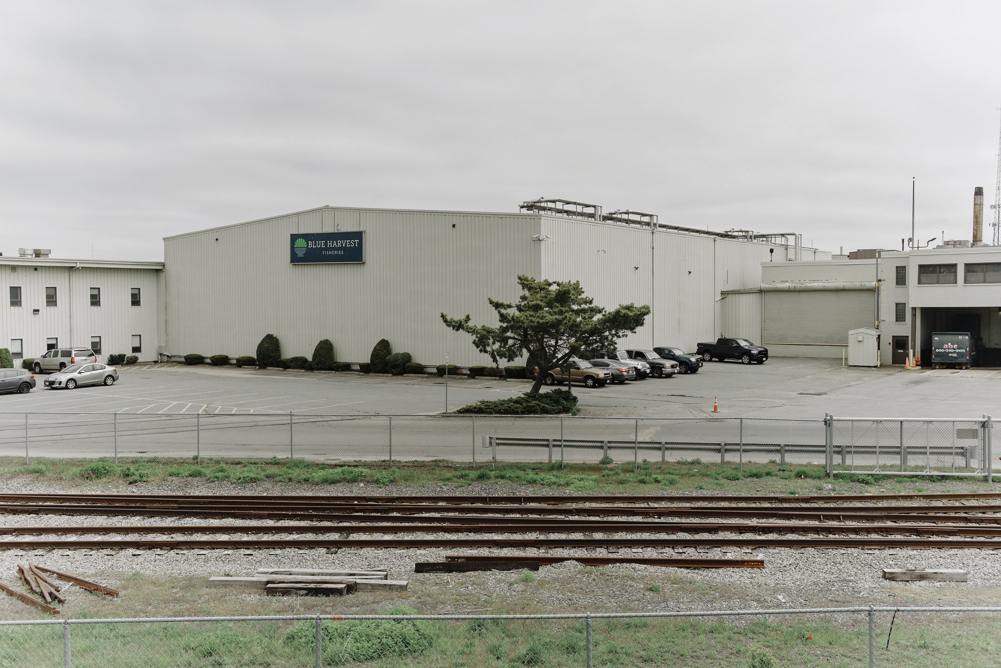 A white wharehouse building with a large 