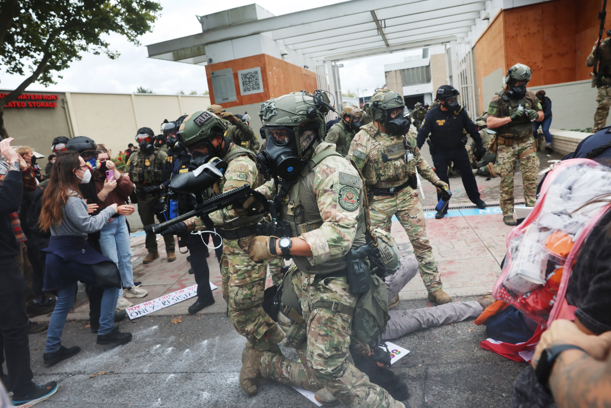 Trump’s Immigration Forces Deploy “Less Lethal” Weapons in Dangerous Ways, Skirting Rules and Maiming Protesters